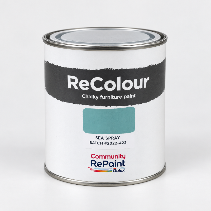 A can of ReColour Sea Spray chalky furniture paint by Community RePaint Dulux, showing a teal color swatch on a white label with a black band.